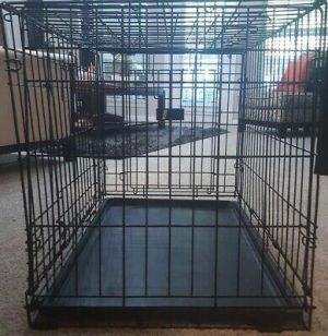 Dog cage small black 18&#039; in tall 23&#039; long. Black metal cage for small dogs. Good